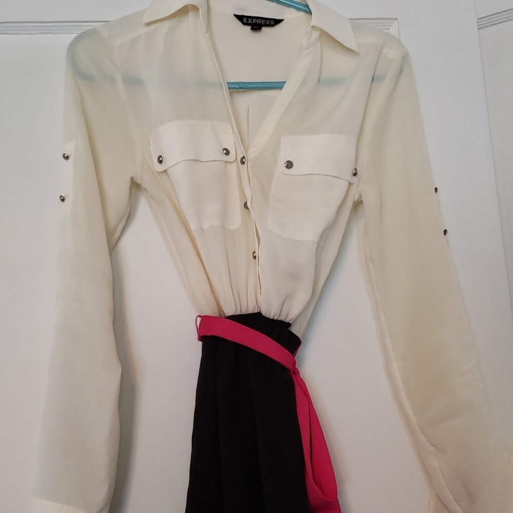 A black and cream dress with a pink silky belt.